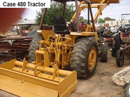 Case 480 tractor in yellow parked outside of a dealership